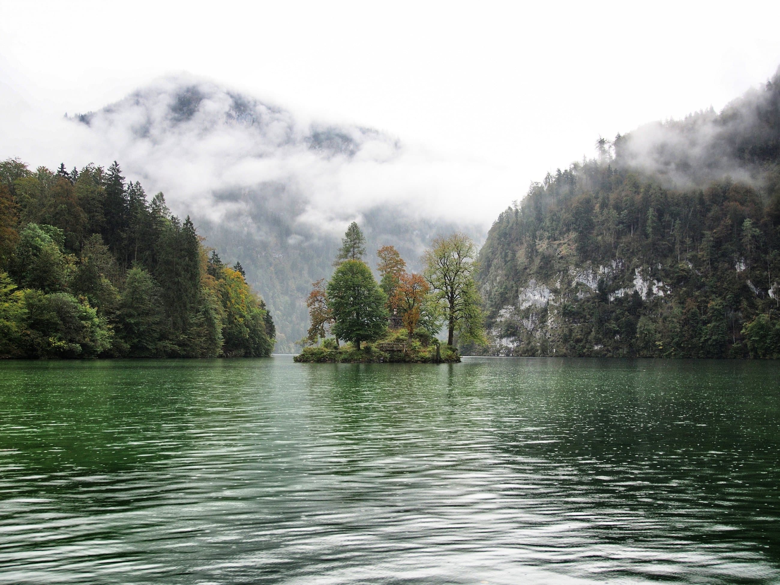 Lake under misty mountains
