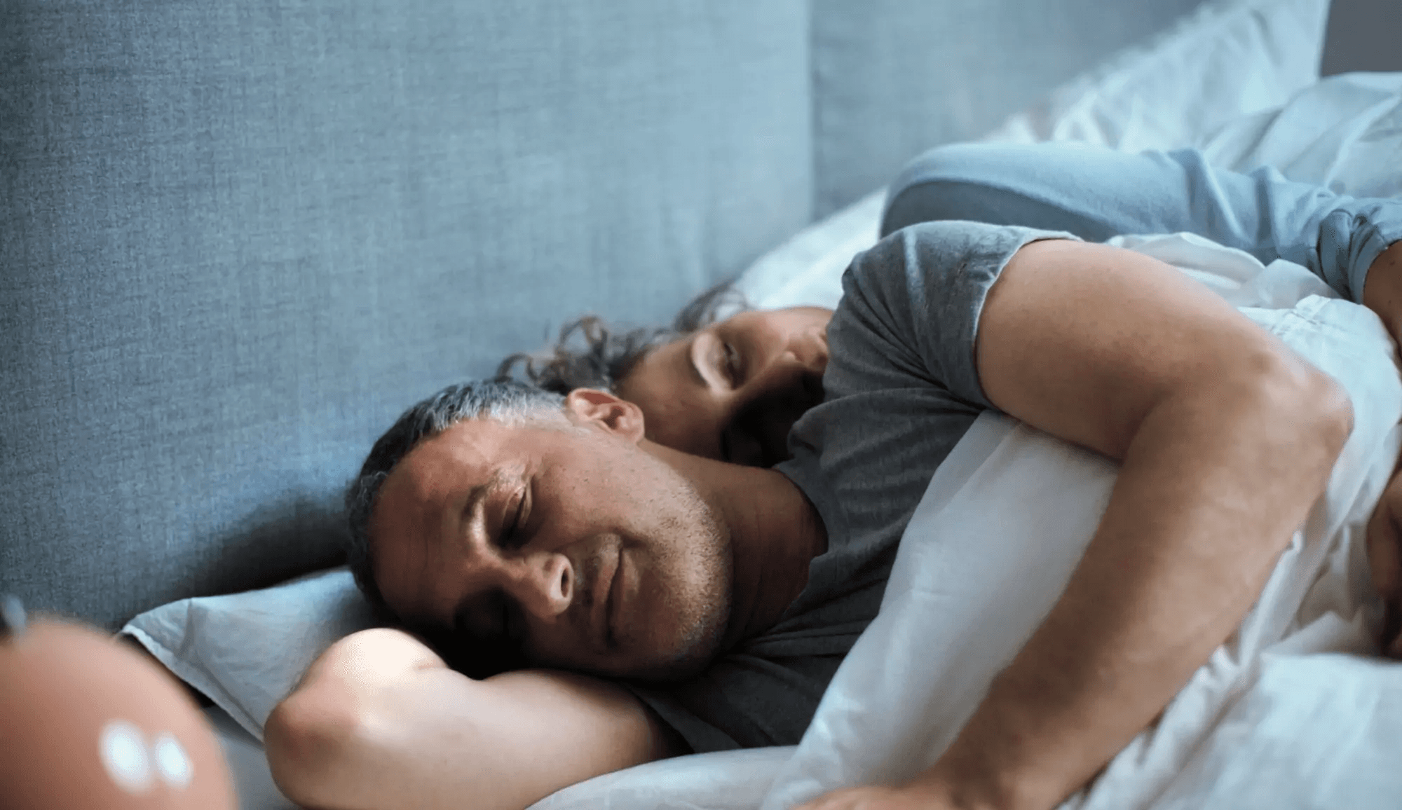 A person asleep wearing the RyseUp device